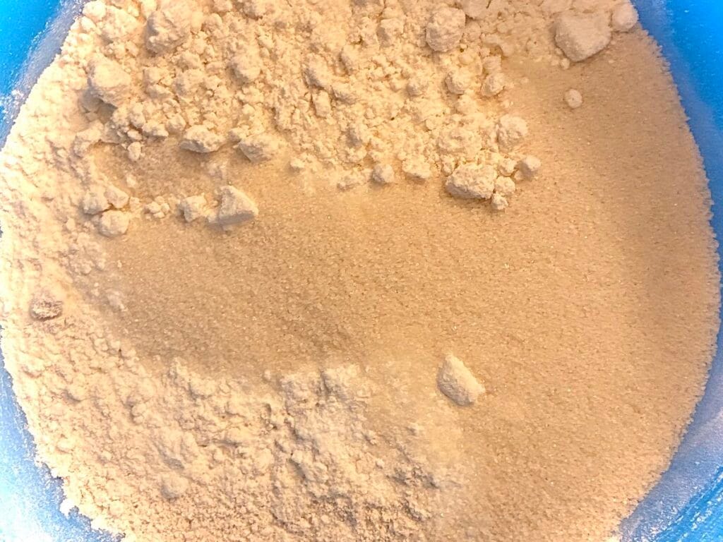 Easy One-Bowl Eggless Blueberry Oat Flour Cake (Low Sugar) 3 Dry ingredients for oat flour cake in a blue mixing bowl