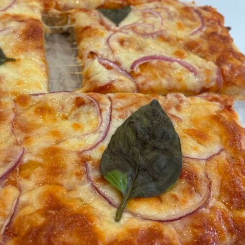 Easy One Bowl Artisan Pizza Dough (With An Oat Flour Twist!) 3 A slice of easy one bowl artisan pizza dough pulled away from the crispy crust.