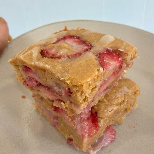 One-Bowl Strawberry Applesauce Snack Cake 6 A slice of strawberry applesauce snack cake stacked to show the soft, jammy texture.