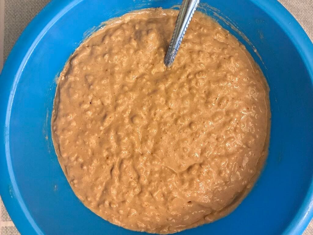 Mixing bowl filled with egg free blueberry quick oat muffin batter