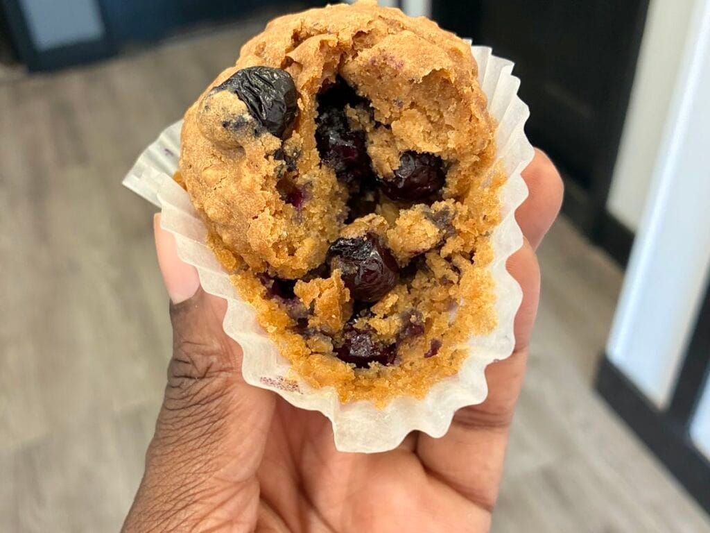 Close up texture shot of the soft inside crumb of an egg free blueberry muffin