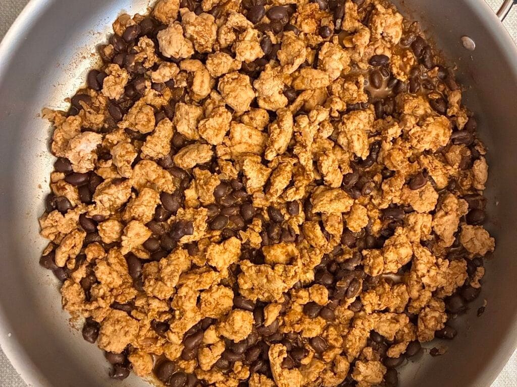 Cooked 10 minute turkey taco skillet mixture simmering on the stovetop