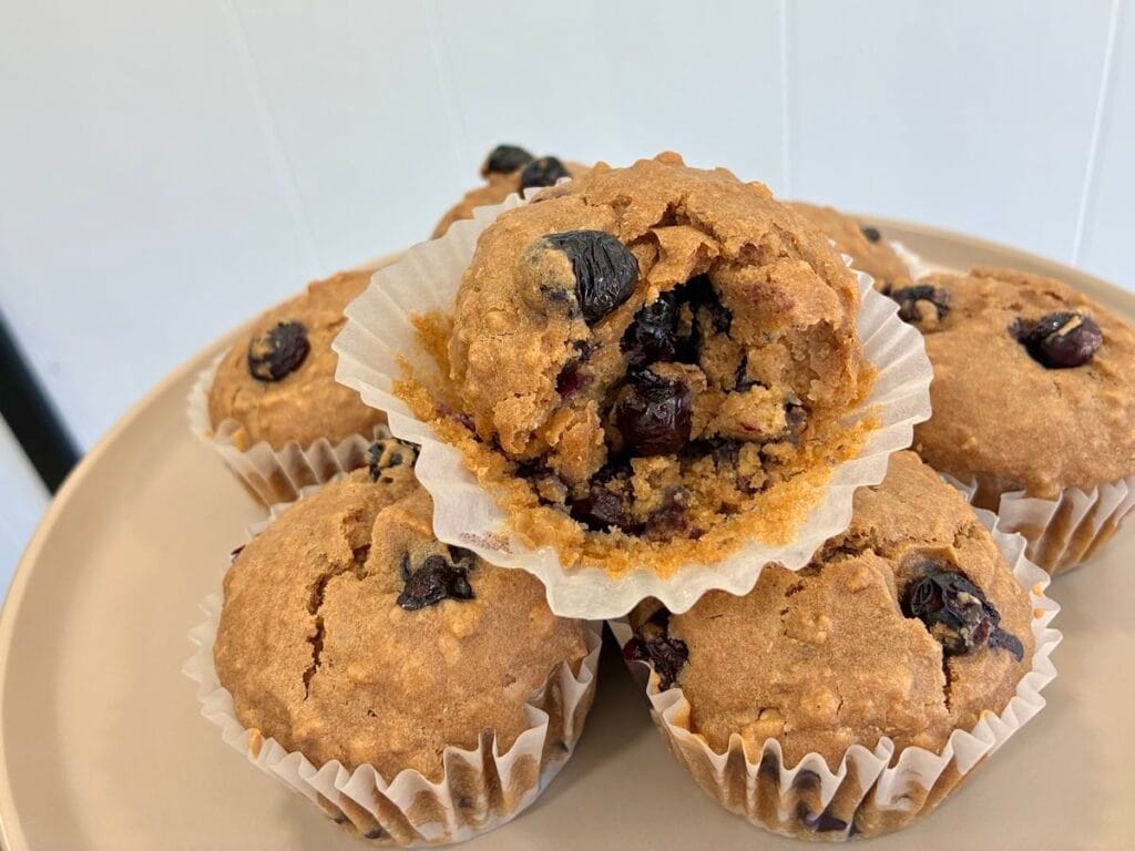 Freshly baked fluffy blueberry muffins made with quick cooking oats, with a texture close-up