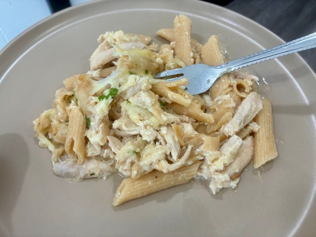 Chicken Alfredo pasta bake serving on a dinner plate