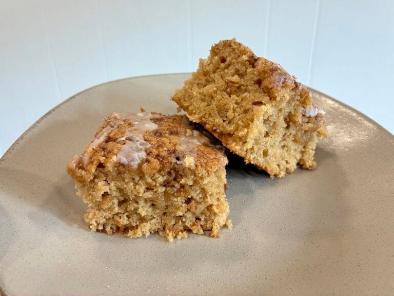 One-Bowl Cinnamon Swirl Snack Cake (Egg-Free Recipe) 1 A beautiful presentation of square slices of soft one-bowl cinnamon swirl snack cake on a plate, highlighting the brown sugar swirls.