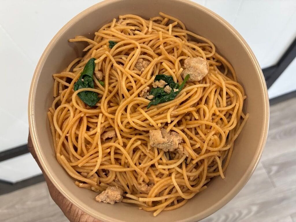 15-Minute Ground Turkey Garlic Noodles (Easy Asian-Inspired Recipe) 2 A comforting serving of savory ground turkey garlic noodles and spaghetti in a matte stoneware bowl.